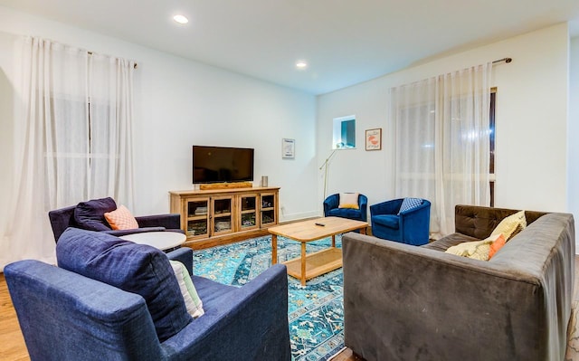 living room with wood finished floors and recessed lighting