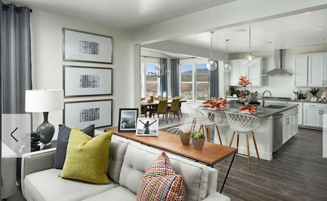 living room featuring dark wood finished floors and recessed lighting