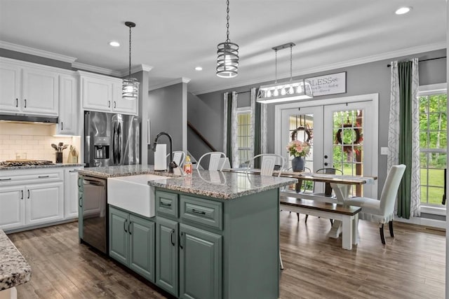 3571 Old Blacktop Rd, Mc Ewen, TN 37101 - kitchen with stainless steel appliances, a sink, french doors, white cabinets, and ornamental molding