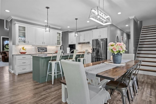 3571 Old Blacktop Rd, Mc Ewen, TN 37101 - dining room featuring recessed lighting, dark wood-style flooring, stairway, and ornamental molding