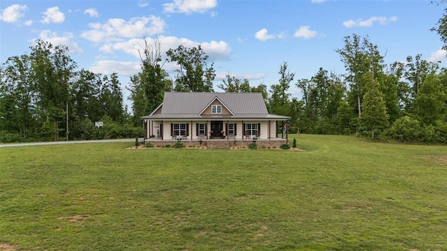 3571 Old Blacktop Rd, Mc Ewen, TN 37101 - view of front of property featuring covered porch, a front yard, and metal roof