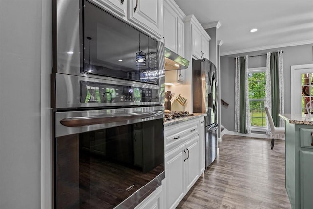3571 Old Blacktop Rd, Mc Ewen, TN 37101 - kitchen featuring crown molding, stainless steel appliances, wall chimney exhaust hood, white cabinetry, and wood finished floors