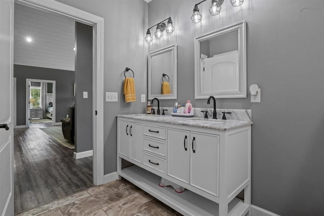 3571 Old Blacktop Rd, Mc Ewen, TN 37101 - bathroom featuring double vanity and baseboards