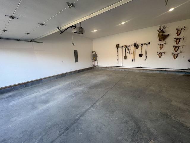 3571 Old Blacktop Rd, Mc Ewen, TN 37101 - garage with a garage door opener and water heater
