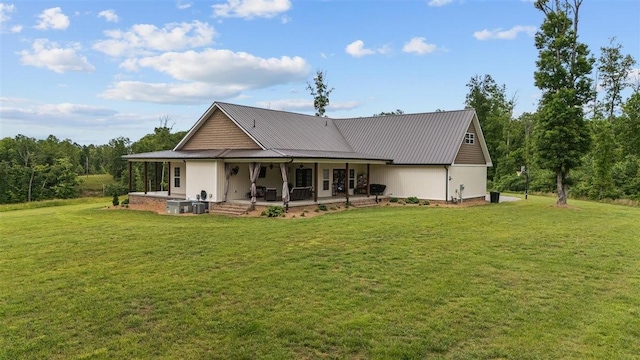 3571 Old Blacktop Rd, Mc Ewen, TN 37101 - back of property with a yard and metal roof