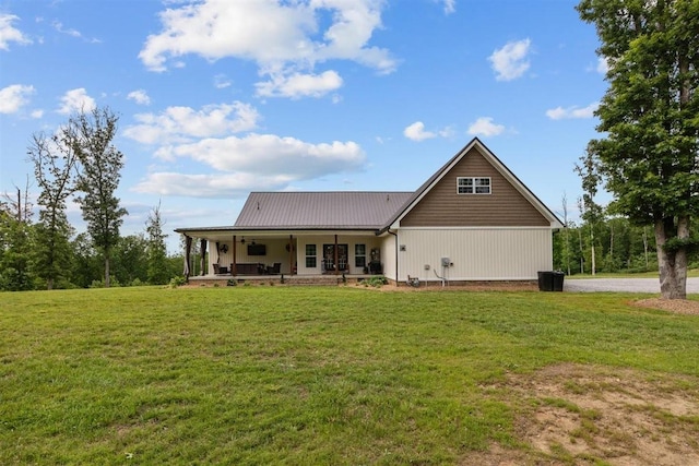 3571 Old Blacktop Rd, Mc Ewen, TN 37101 - rear view of house with a yard and metal roof