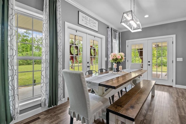 3571 Old Blacktop Rd, Mc Ewen, TN 37101 - dining room featuring french doors, ornamental molding, healthy amount of natural light, a chandelier, and wood finished floors