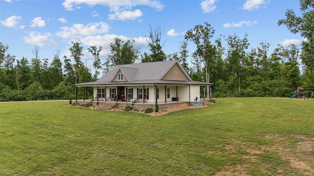 3571 Old Blacktop Rd, Mc Ewen, TN 37101 - view of front of house with a front yard, covered porch, and a playground