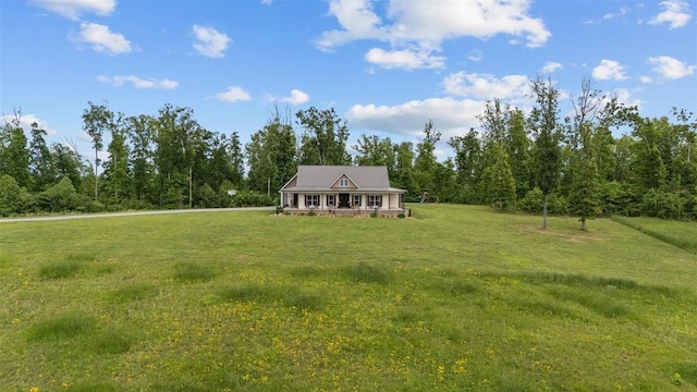 3571 Old Blacktop Rd, Mc Ewen, TN 37101 - view of front of house with a front yard and a wooded view