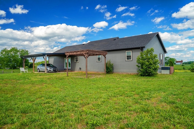 82 Staggs Rd, Ethridge, TN 38456 - rear view of property with a carport, a lawn, and a pergola