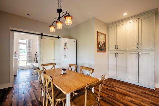 82 Staggs Rd, Ethridge, TN 38456 - dining room with a barn door, dark wood-type flooring, washer / dryer, and recessed lighting
