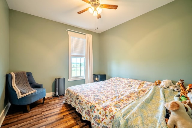 82 Staggs Rd, Ethridge, TN 38456 - bedroom with radiator, wood finished floors, baseboards, and ceiling fan