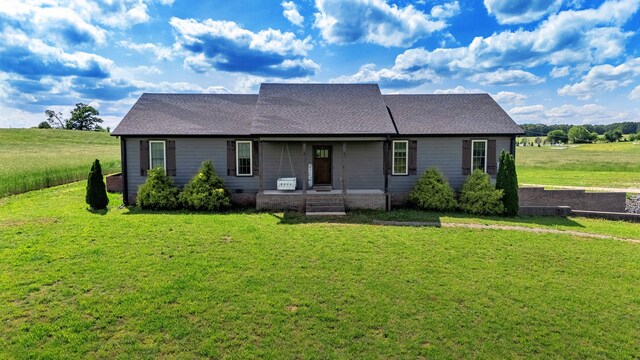 82 Staggs Rd, Ethridge, TN 38456 - view of front of house with a front lawn, a porch, and roof with shingles