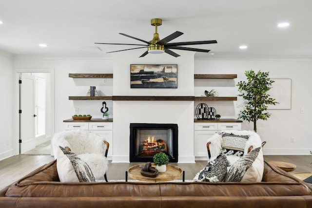 358 Coopertown Rd, Unionville, TN 37180 - living room featuring a ceiling fan, ornamental molding, recessed lighting, a lit fireplace, and light wood-style flooring