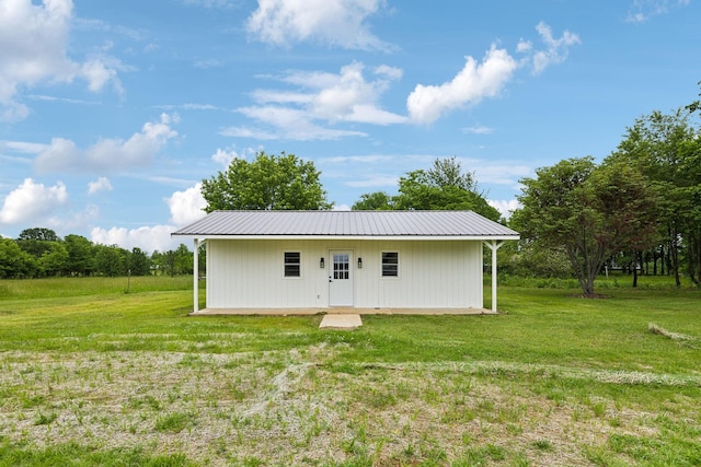 358 Coopertown Rd, Unionville, TN 37180 - rear view of house with a lawn, metal roof, and an outbuilding