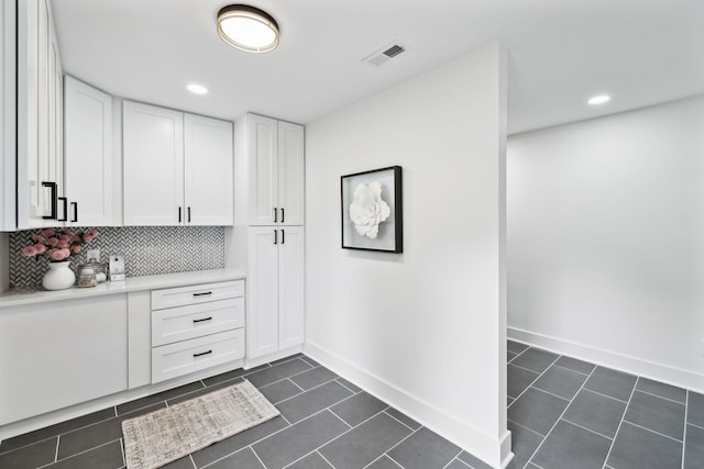 358 Coopertown Rd, Unionville, TN 37180 - kitchen featuring light countertops, white cabinets, tasteful backsplash, baseboards, and dark tile patterned floors