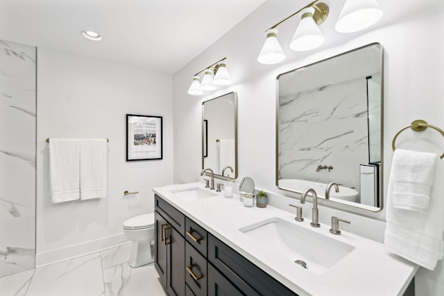358 Coopertown Rd, Unionville, TN 37180 - bathroom with marble look tile flooring, toilet, baseboards, double vanity, and a freestanding bath