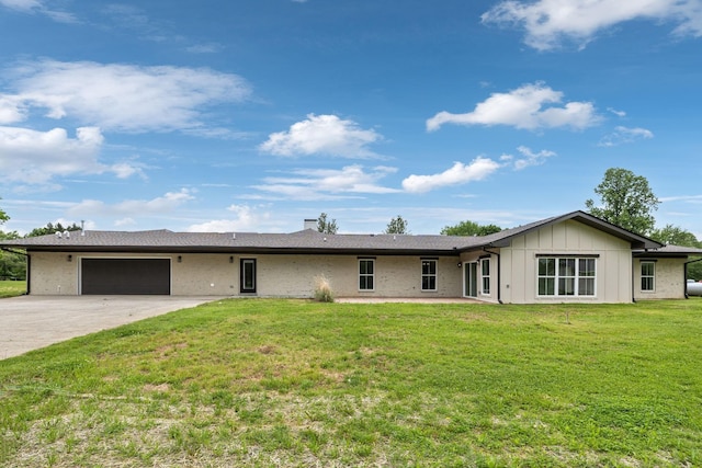 358 Coopertown Rd, Unionville, TN 37180 - view of front of home featuring an attached garage, concrete driveway, a front lawn, and board and batten siding