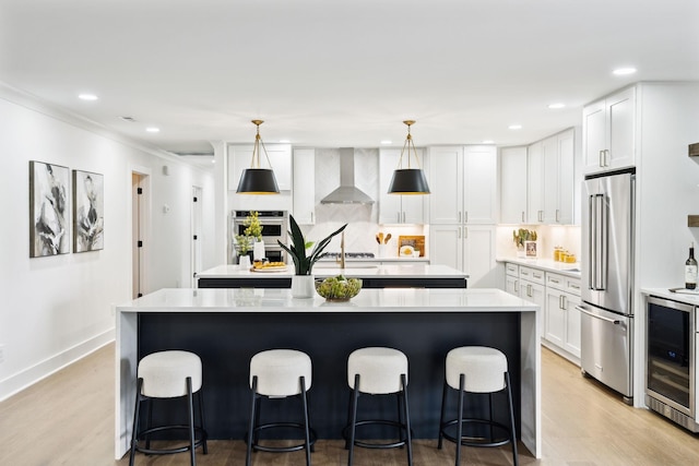358 Coopertown Rd, Unionville, TN 37180 - kitchen with stainless steel appliances, beverage cooler, a center island, wall chimney exhaust hood, and light countertops