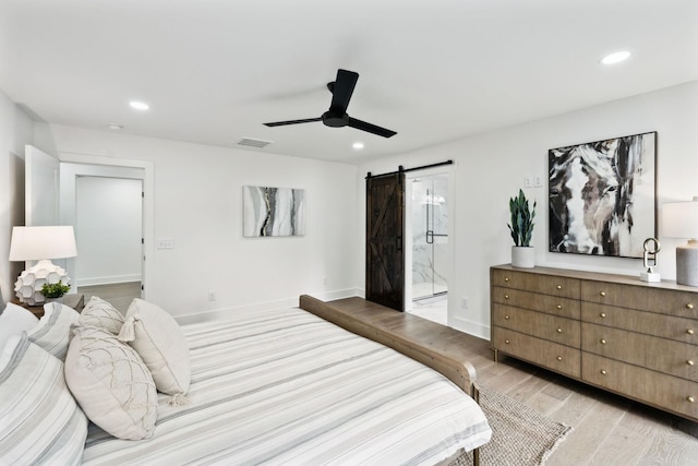 358 Coopertown Rd, Unionville, TN 37180 - bedroom with a barn door, light wood finished floors, recessed lighting, baseboards, and ensuite bathroom