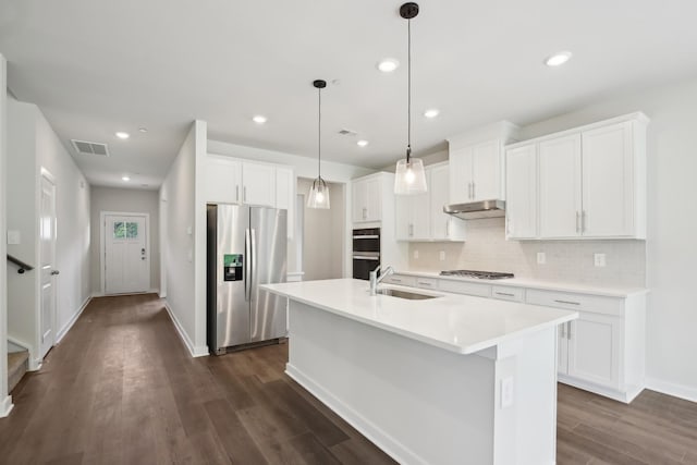 4621 Winslet Dr, Smyrna, TN 37167 - kitchen featuring stainless steel appliances, a sink, decorative backsplash, white cabinets, and recessed lighting