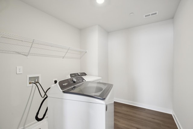 4621 Winslet Dr, Smyrna, TN 37167 - washroom featuring separate washer and dryer, dark wood-style flooring, and baseboards