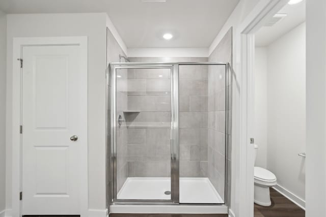 4621 Winslet Dr, Smyrna, TN 37167 - full bath with toilet, a shower stall, wood finished floors, recessed lighting, and baseboards