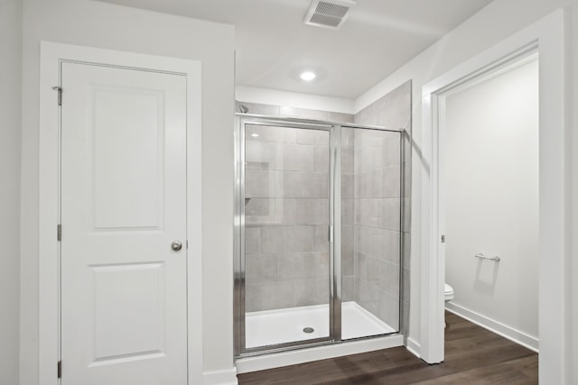 4621 Winslet Dr, Smyrna, TN 37167 - full bath featuring toilet, a stall shower, baseboards, wood finished floors, and recessed lighting