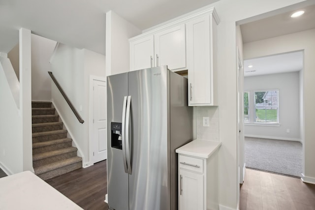 4621 Winslet Dr, Smyrna, TN 37167 - kitchen with stainless steel fridge, dark wood-type flooring, white cabinets, light countertops, and recessed lighting