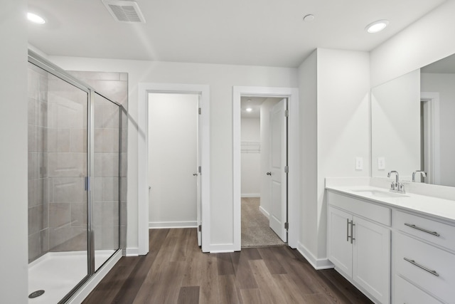 4621 Winslet Dr, Smyrna, TN 37167 - bathroom featuring a shower stall, vanity, wood finished floors, recessed lighting, and baseboards