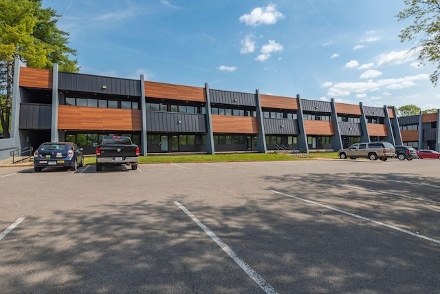 view of commercial property with uncovered parking