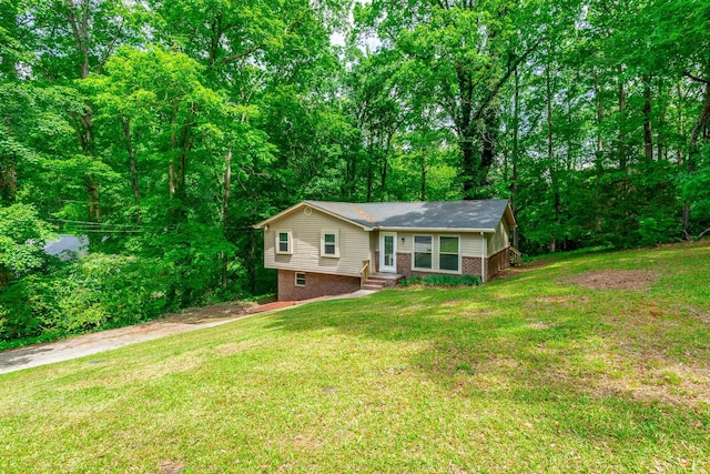 ranch-style house with brick siding, entry steps, and a front lawn
