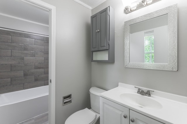 bathroom featuring vanity, toilet, and ornamental molding