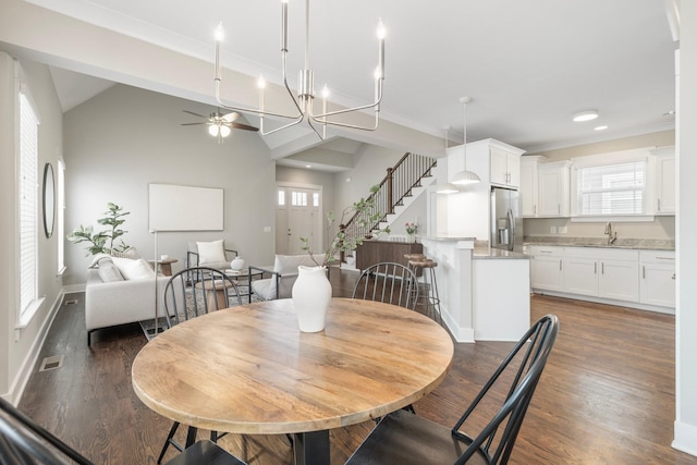 513 Westboro Dr, Nashville, TN 37209 - dining area with a ceiling fan, healthy amount of natural light, wood finished floors, ornamental molding, and stairway