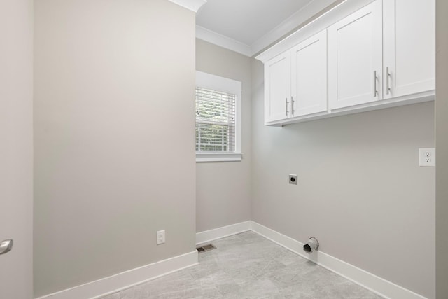 513 Westboro Dr, Nashville, TN 37209 - clothes washing area featuring hookup for an electric dryer, cabinet space, baseboards, and ornamental molding