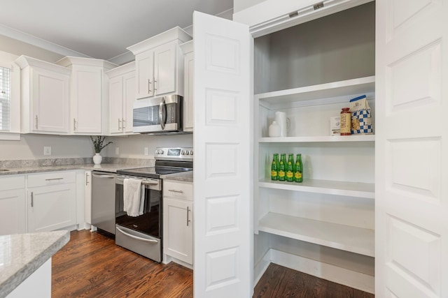 513 Westboro Dr, Nashville, TN 37209 - kitchen with appliances with stainless steel finishes, white cabinetry, dark wood finished floors, and light stone countertops