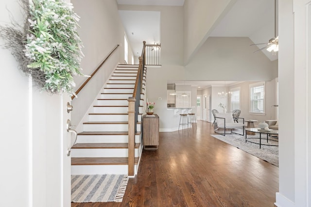 513 Westboro Dr, Nashville, TN 37209 - foyer featuring a high ceiling, a ceiling fan, wood finished floors, stairs, and baseboards