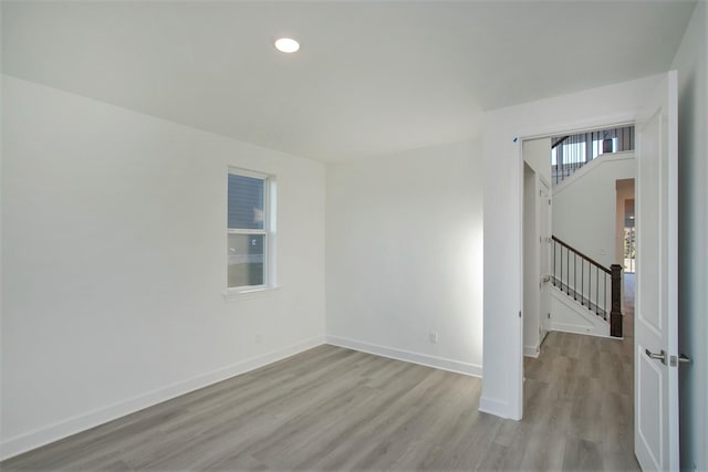 113 W Cassa Way, Mount Juliet, TN 37122 - unfurnished room with wood finished floors, stairway, baseboards, and recessed lighting