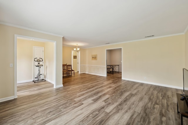 2130 River Chase Dr, Murfreesboro, TN 37128 - unfurnished living room featuring a chandelier, ornamental molding, wood finished floors, and baseboards