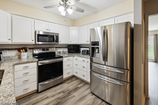 2130 River Chase Dr, Murfreesboro, TN 37128 - kitchen with appliances with stainless steel finishes, ceiling fan, white cabinets, and decorative backsplash
