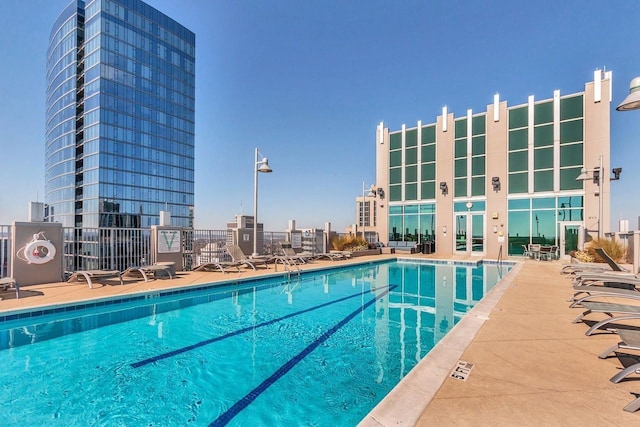 community pool featuring a patio area