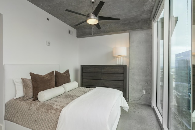 bedroom with a ceiling fan and concrete floors