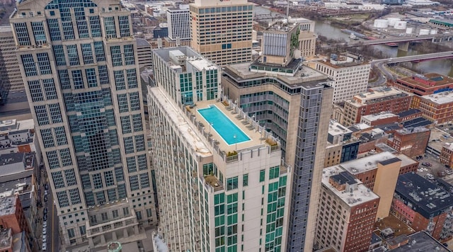 view of urban area with a notable bridge and a pool