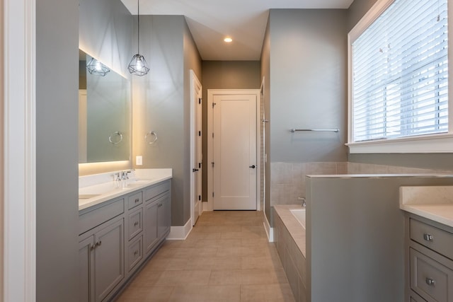 504 Doubleday Ln, Brentwood, TN 37027 - bathroom with double vanity, a bath, baseboards, and recessed lighting