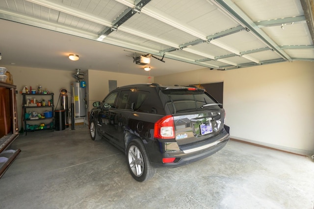 garage with gas water heater and a garage door opener