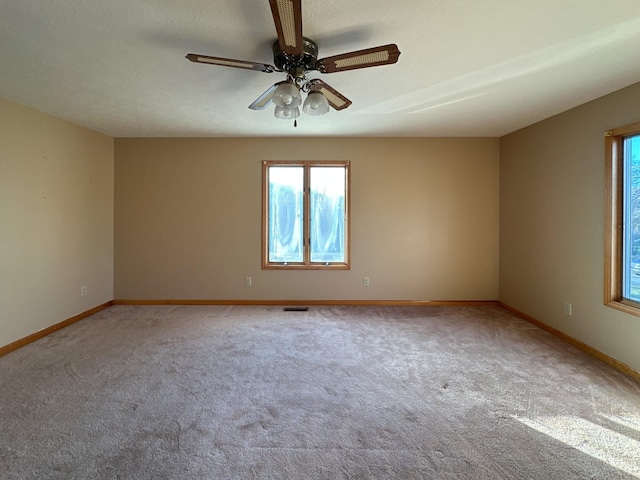 311 Locust St, Alexandria, TN 37012 - carpeted empty room with healthy amount of natural light, ceiling fan, and baseboards