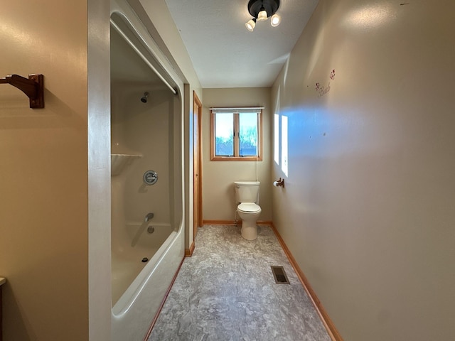 311 Locust St, Alexandria, TN 37012 - bathroom featuring toilet, baseboards, and bathing tub / shower combination