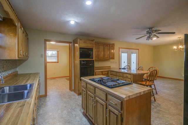 311 Locust St, Alexandria, TN 37012 - kitchen with black appliances, a sink, butcher block countertops, a ceiling fan, and plenty of natural light