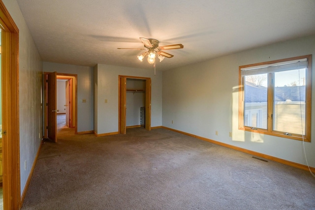 311 Locust St, Alexandria, TN 37012 - unfurnished bedroom featuring carpet, baseboards, a closet, and a ceiling fan