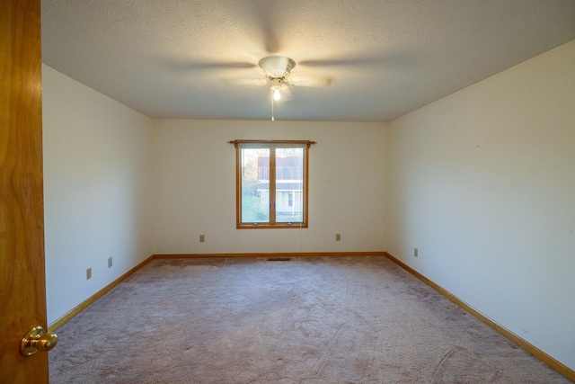 311 Locust St, Alexandria, TN 37012 - spare room featuring carpet, baseboards, a textured ceiling, and a ceiling fan